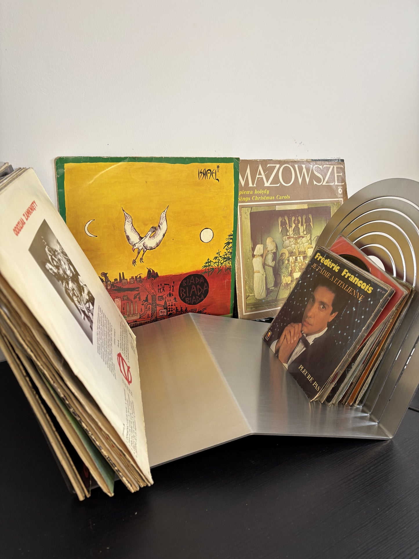 Collection of vintage books with colorful covers on a white surface.