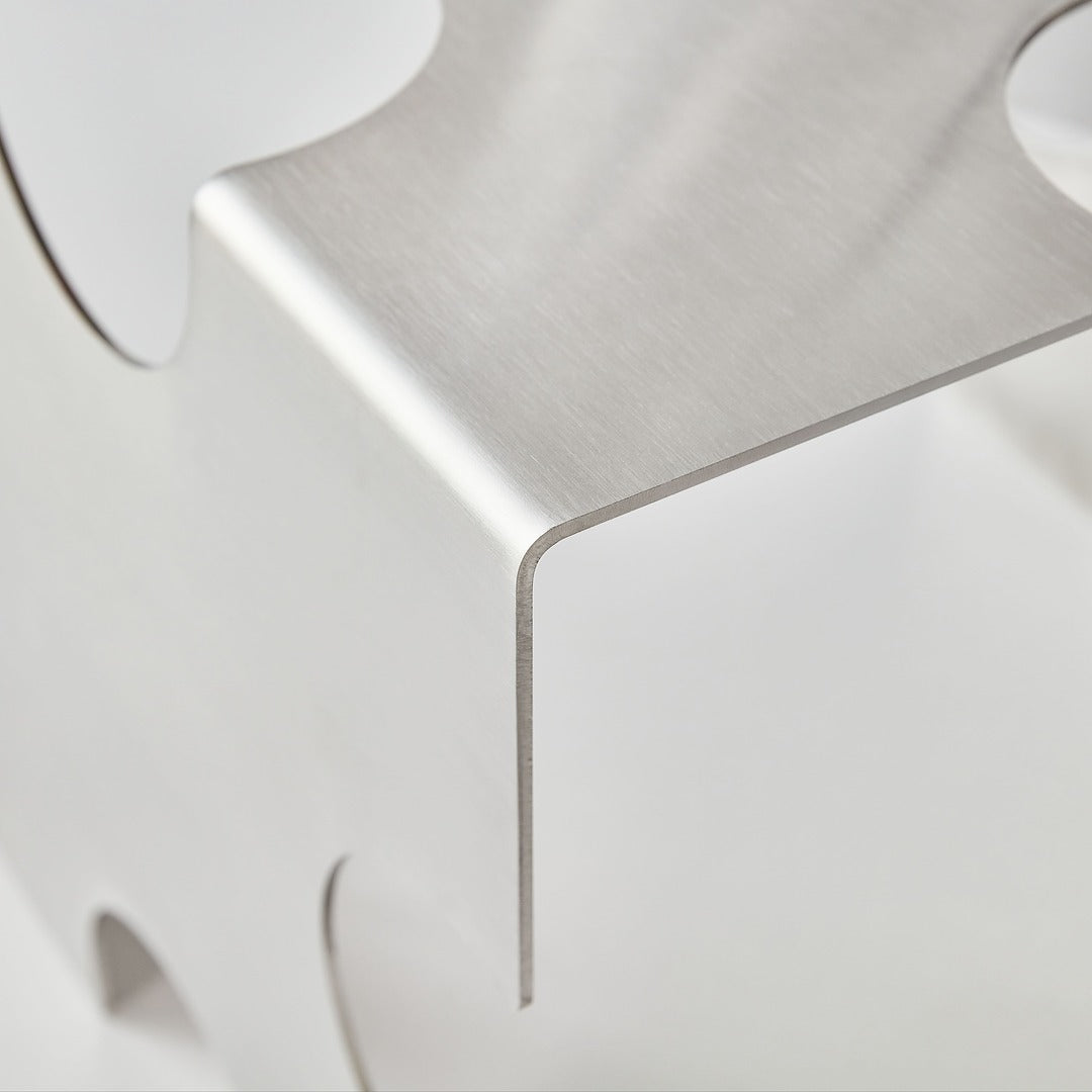 Close-up of a metallic surface with a geometric design